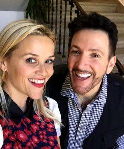 A man with Reese Witherspoon
